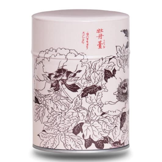 Metal tea caddy illustrated with a design of Japanese flowers with Japanese characters on a pink/beige background