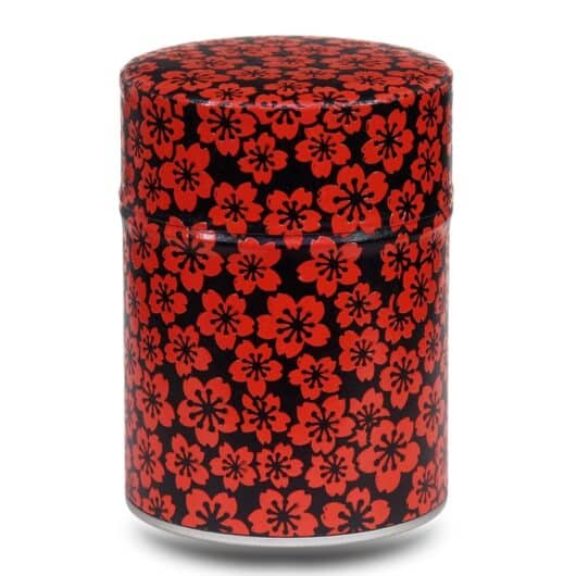 boite a the noir avec motifs fleurs rouges